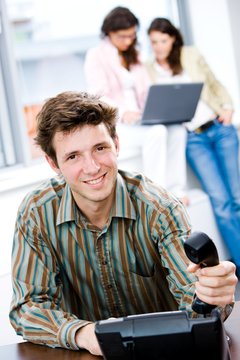 Businessman with phone at office