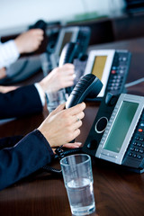 Hands holding phones