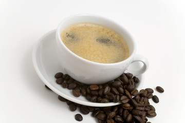 Cup of coffee with beans