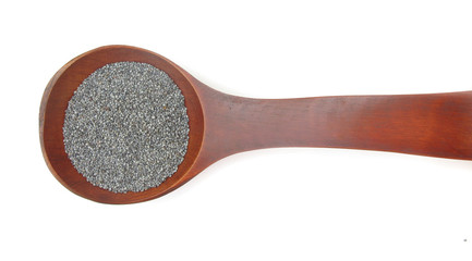 Poppy seeds blue in wooden sppon