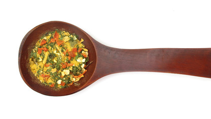 Vegetables and spices dried condiment in wooden spoon