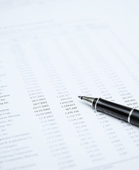 financial report and pen