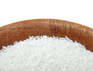 Coconut grated in wooden dish