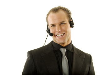 Successful young businessman wearing headphones