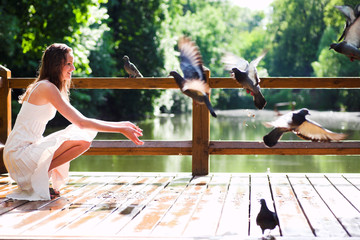 Smiling sit with doves