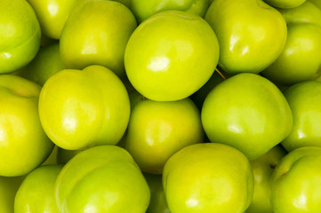 Green apples arranged on the market stand