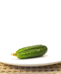 Ripe cucumber on a plate