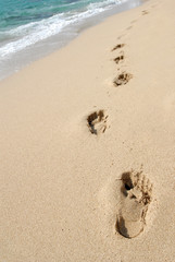 Fußspuren am Strand