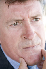 Head shot of man thinking