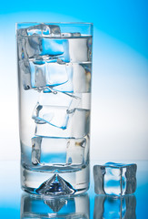 Tall iced drink on blue backlit