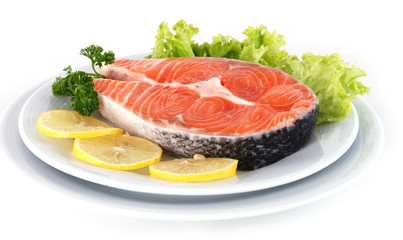 Raw Salmon steak garnish with lemon and lettuce