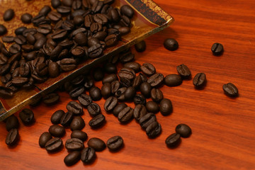 coffee seeds on red wooden table