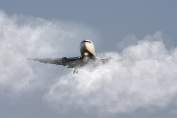 Airliner through the clouds