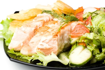 Stake from a salmon with vegetables