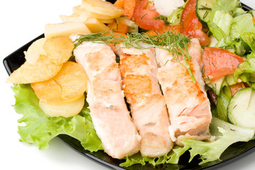 Stake from a salmon with vegetables