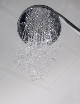 Shower head with water having been just turned on.