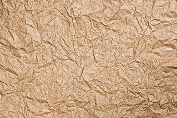 Old rough crumpled paper texture close up.