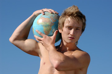 Young Muscular Man with a Globe