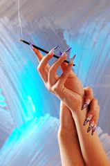 woman's hand with smoke pipe