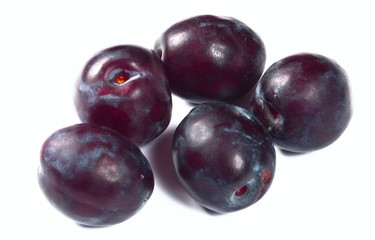 Fresh plumbs on white background