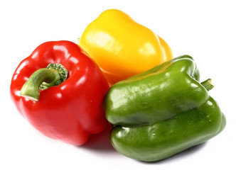 red, yellow and green paprika on white background