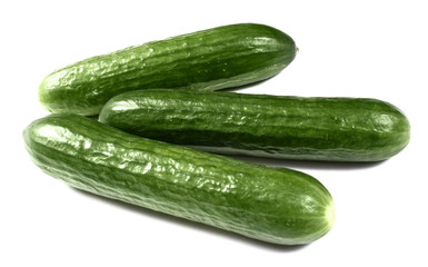 Fresh cucumbers on white