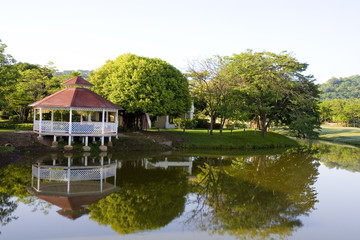 Obraz premium Gazebo and Trees on Lake