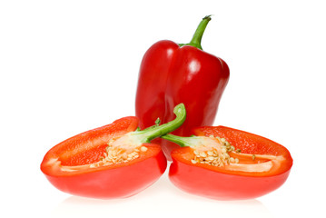 Whole red sweet pepper and two halves