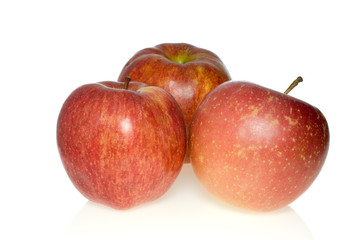 Fototapeta na wymiar Three red apples of different breeds