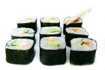 set of sushi and chopsticks over white