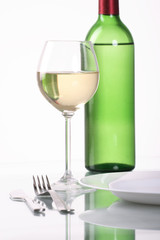 Bottle and glass of  wine  on white background