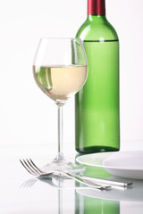 Bottle and glass of  wine  on white background