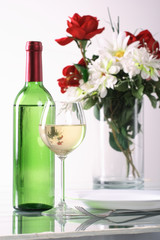 Bottle and glass of  wine  on white background