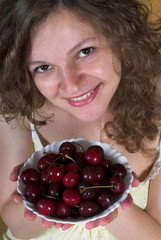 Young woman with cherries