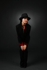 pretty teen in black pantsuit and tophat