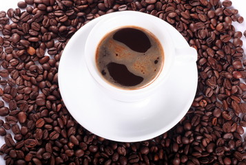 White cup and coffee beans