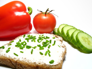 Detail bread with butter and fresh vegetable