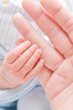 baby's grasping hand