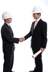 Two young Engineers closing a deal