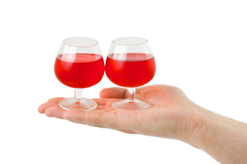 Hand and wineglasses