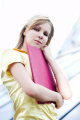 business girl in yellow with folder