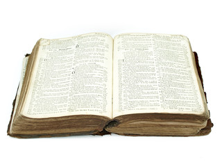 Large vintage open bible isolated against a white background