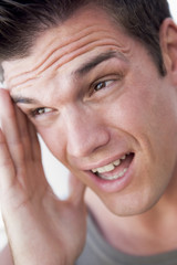 Obraz premium Head shot of man scowling