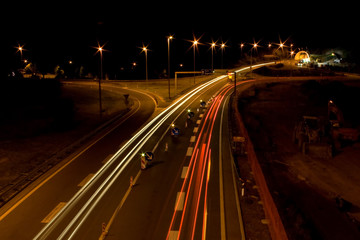 Fototapeta na wymiar Straight night highway with car's traces