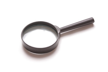 Magnifying glass against white background