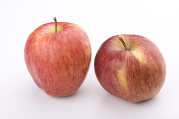 Fototapeta na wymiar two red apples on white background