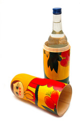 matreshka and vodka on a white backgraund
