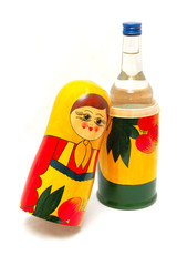 matreshka and vodka on a white backgraund