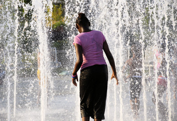 young woman in a fountain
