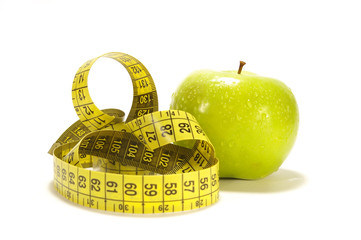 Yellow apple and tape measure